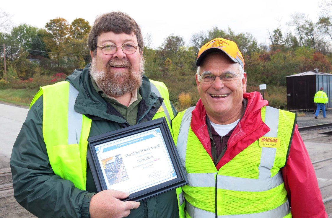 Brian Davis receiving the Shiny Wheel Award from President Bob Knight