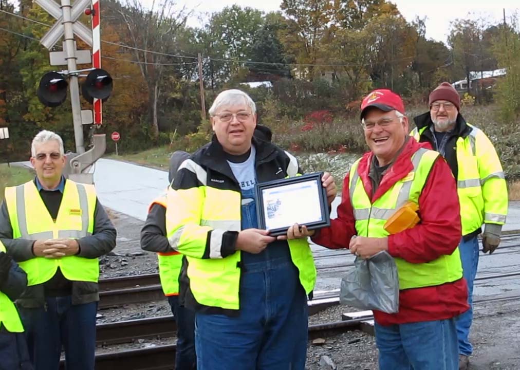 Dan Page receiving the Shiny Wheel Award from President Bob Knight