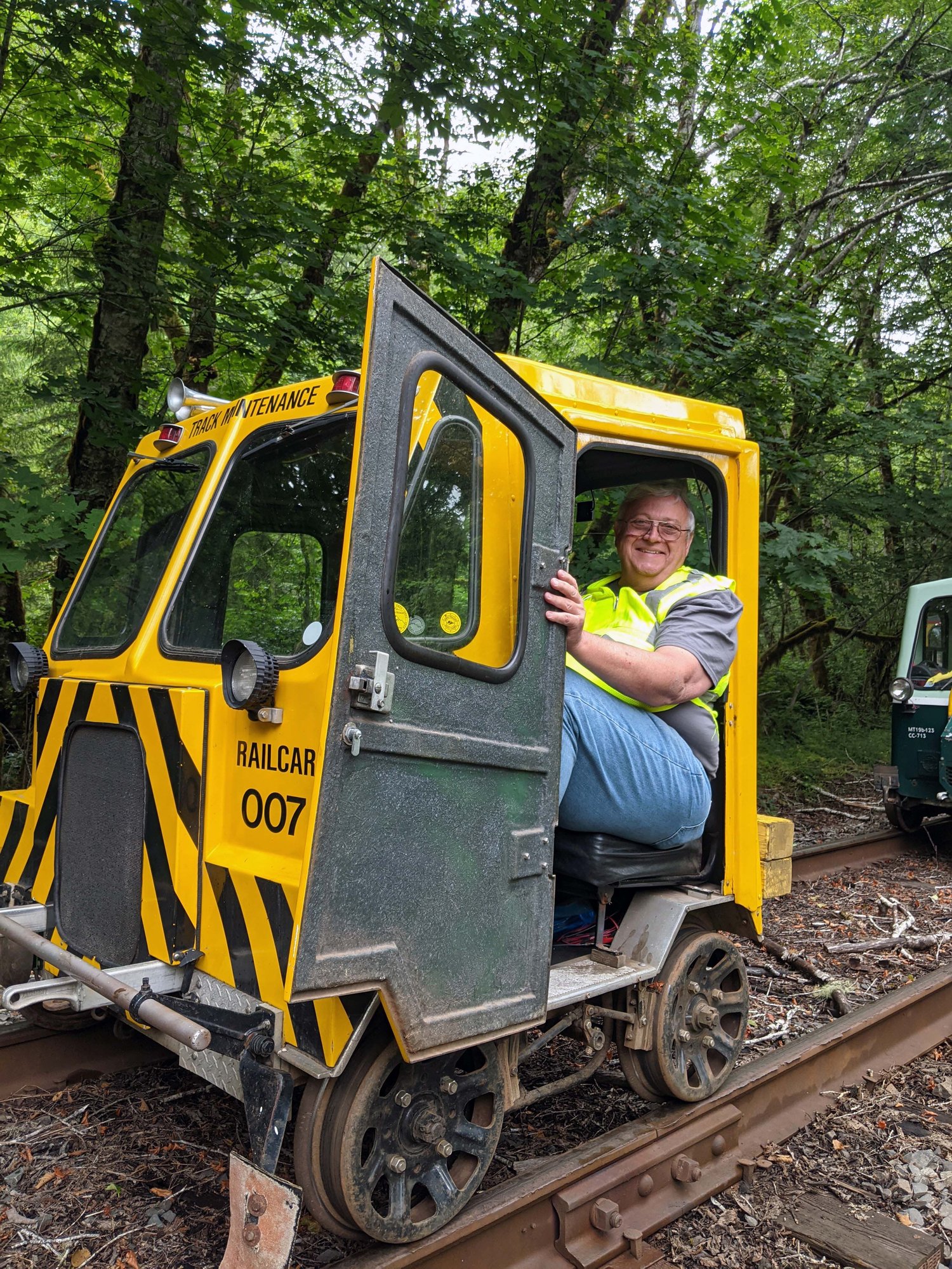 Railcars stopped in Oregon's coastal rainforest along the Coos Bay Rail Line