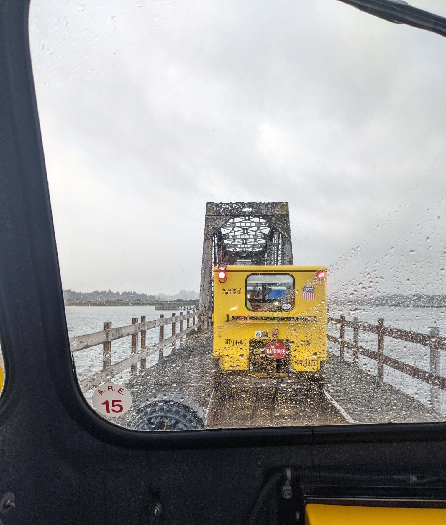 Railcars waiting in the rain for a Coos Bay Rail Line drawbridge to close