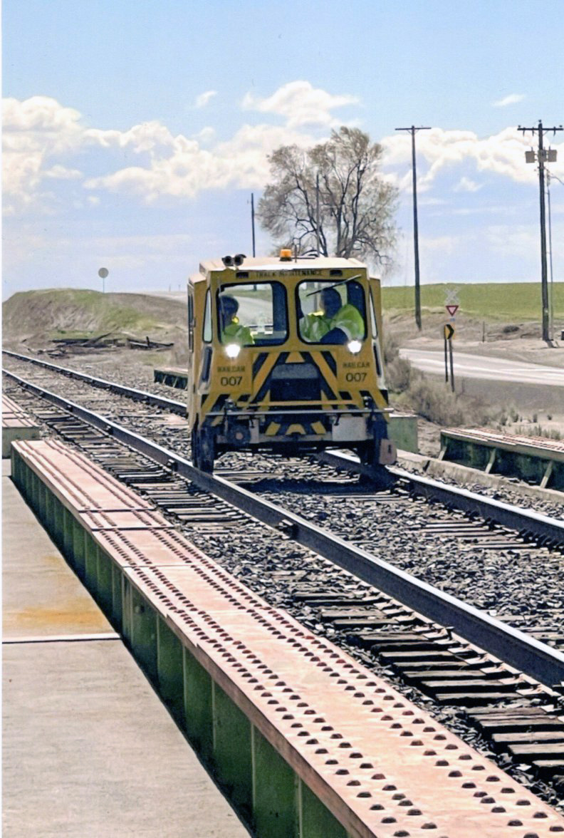 Rail Car 007 crossing an irrigation canal on the Columbia Basin Railroad